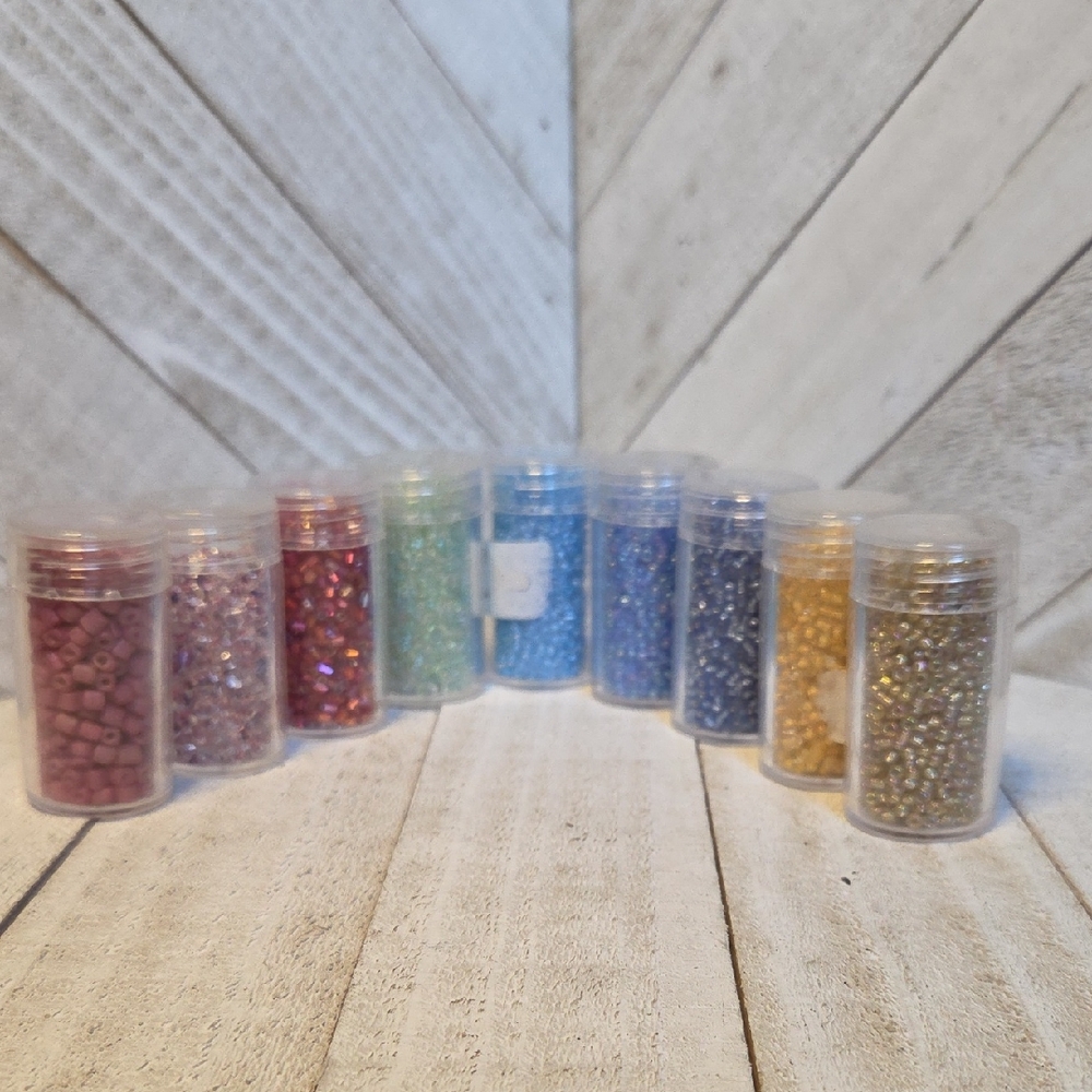 9 Small Containers Of Crafting Beads Blues, Pinks, Green, Beige/Gold